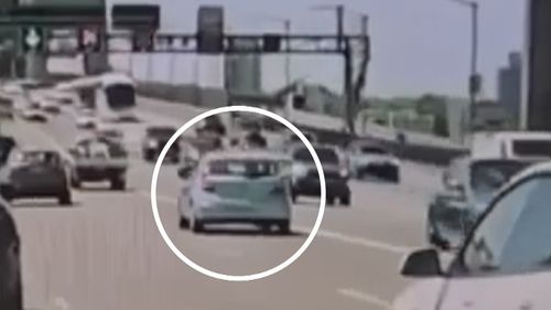 Dashcam footage shows a small hatchback veering into oncoming traffic﻿ before it collides with a car heading in the other direction. 