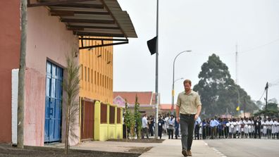 Prince Harry walking the same part of Huambo, September 2019