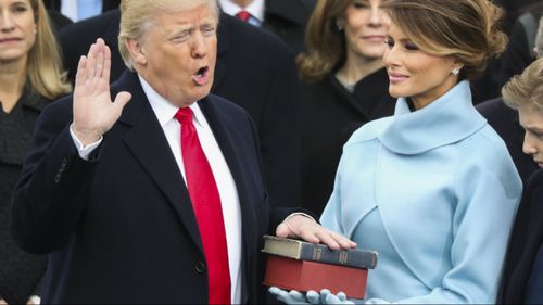 Donald Trump is sworn in as the 45th President of the United States on January 20, 2017, with wife Melania holding the Bible.