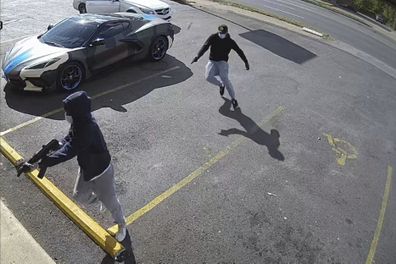 This video image, provided by the Memphis Police Department, shows two people with guns drawn after exiting their vehicle, a white Mercedes-Benz, which authorities say was involved in the shooting of 36-year-old rapper Young Dolph on Wednesday 17 November.  , 2021.