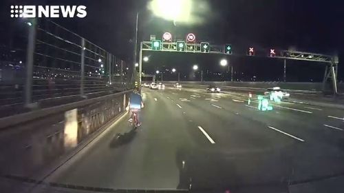 The cyclist made the dangerous to decision to ride over the Sydney Harbour Bridge.
