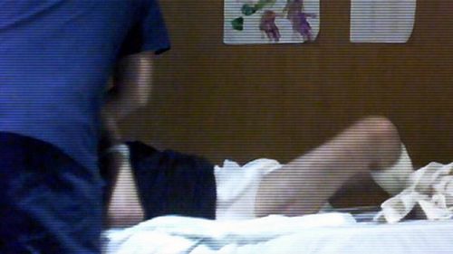In another part of the footage, the nurse appears to hold Billy down on the bed.