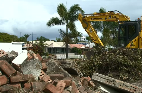 Tradies have unearthed thousands of dollars in cash buried in a Gold Coast backyard.