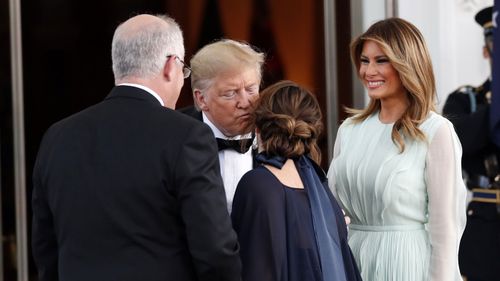 President Donald Trump and first lady Melania greet Australian Prime Minister Scott Morrison and his wife Jenny.