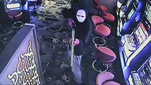 Three armed robbers threatened hotel staff with a firearm and a machete.