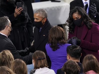 President-elect Kamala Harris and her husband Doug Emhoff talk with former President Barack Obama and his wife Michelle as they arrive for the 59th Presidential Inauguration at the U.S. Capitol in Washington, Wednesday, Jan. 20, 2021. (AP Photo/Carolyn Kaster)