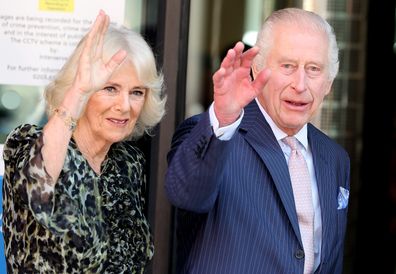 King Charles III and Queen Camilla wave as they arrive at the University College Hospital Macmillan Cancer Centre on April 30, 2024 in London