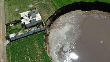 The sinkhole is threatening this home and the occupants have been evacuated. central mexico