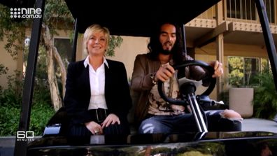 Russell Brand takes Liz Hayes for spin around the movie set.