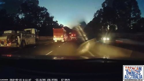 Dash cam captures beer keg slamming into car windscreen . 