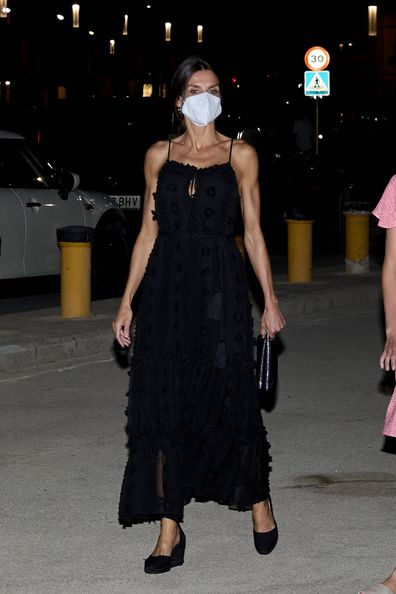 Queen Letizia of Spain wears a black dress while on holiday in Mallorca.