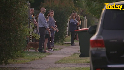 Neighbours came together to commemorate ANZAC Day while social distancing. 