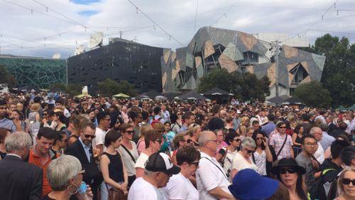 Thousands gathered at Federation Square to pay tribute to the Bourke Street Mall victims. (9NEWS)