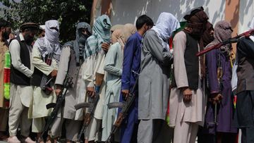 Taliban militants and Islamic State fighters are seen in a surrender ceremony in Kunar province, Afghanistan.