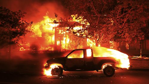 Coffey Park homes burn early Monday in Santa Rosa. (AAP)