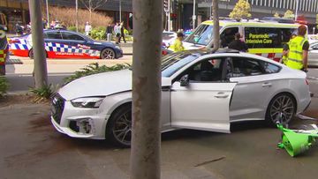 Two people have been ﻿rushed to hospital after being hit by a car outside a Sydney shopping centre.A 64-year-old man and a 34-year-old woman were treated for suspected spinal and head injuries after allegedly being hit by a white Audi in Zetland, in the city&#x27;s south, about 11am.