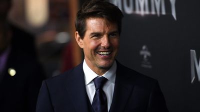 Tom Cruise is all smiles on the black carpet at the State Theatre. (AAP)
