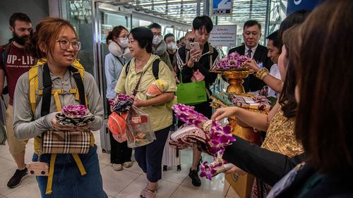 Chinese tourists are welcomed at Bangkok's Suvarnabhumi International Airport