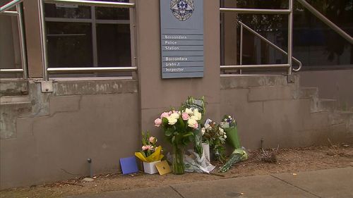 Tributes to four police officers have been left at the Boroondara Police Station in Kew.