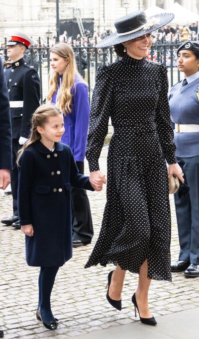 Princess Charlotte holds hands with mum Kate Middleton as they attend Prince Philip's memorial service March 2022.