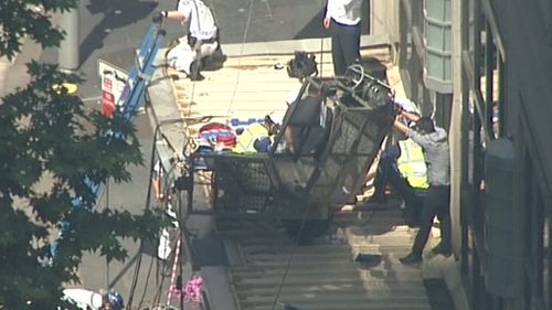 The scaffolding collapsed onto an awning. (9NEWS)