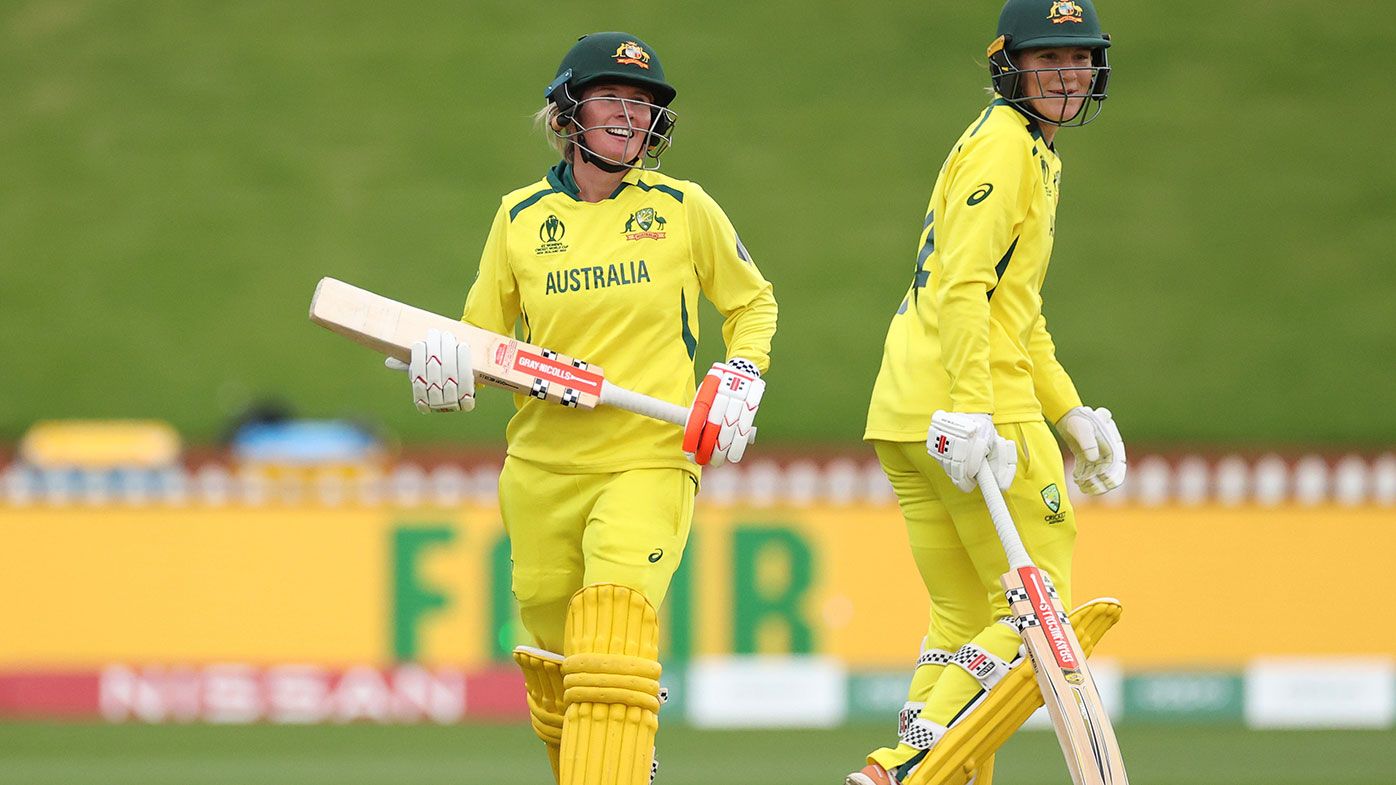 Beth Mooney of Australia (L) celebrates after she hits a four with Annabel Sutherland of Australia 