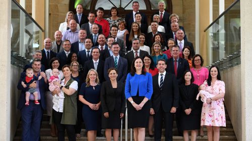 Queensland Premier Annastacia Palaszczuk and all members of her government pose for a group photo after the first Labor caucus meeting in Brisbane this morning (AAP)