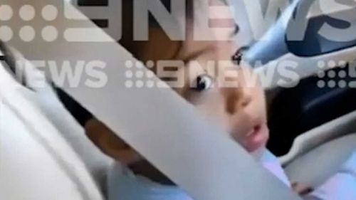 John Hopoate's daughter posted video to Instagram of a toddler in the front seat of the car.