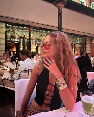 Rita Ora seemingly confirms wedding speculation in an Instagram with wedding band on.