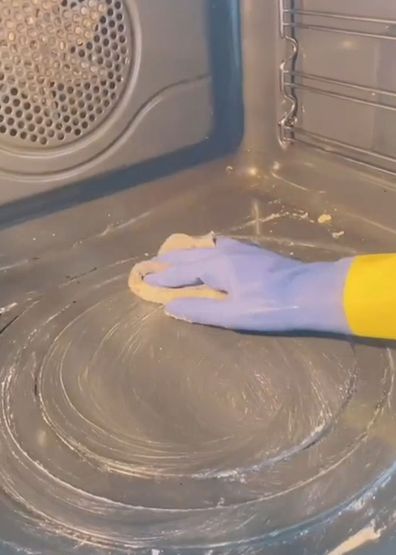Woman shares TikTok hack for cleaning oven while you sleep.