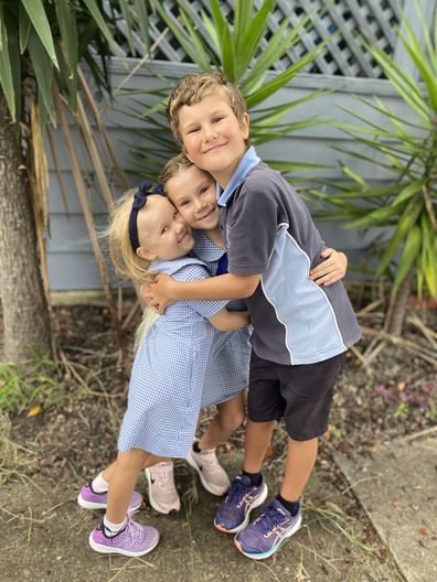 Roxy (left) with her big sister and brother towards the end of her treatment.