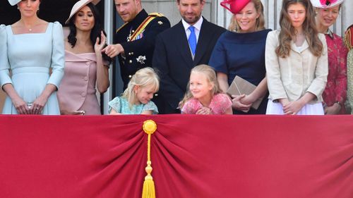 Another young royal can be seen peering down at the missing boy while Savannah attempts to ignore his antics. Picture: PA