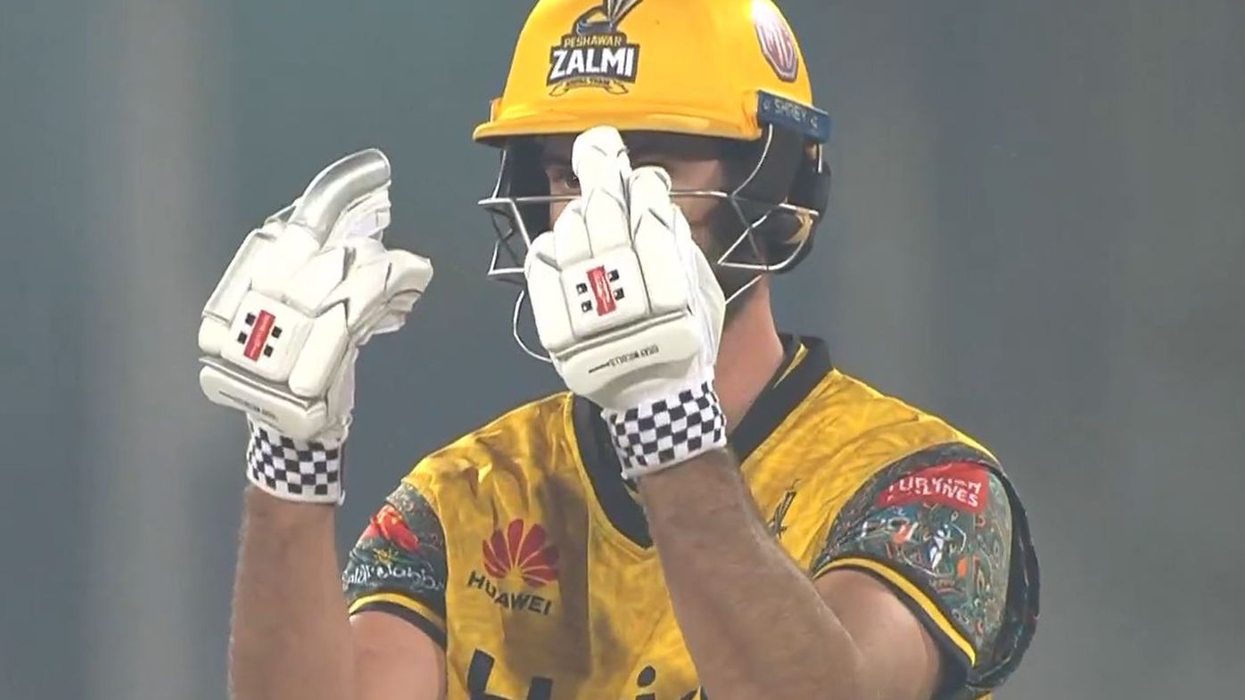 Ben Cutting gestures at Sohail Tanvir during a Pakistan Super League match.