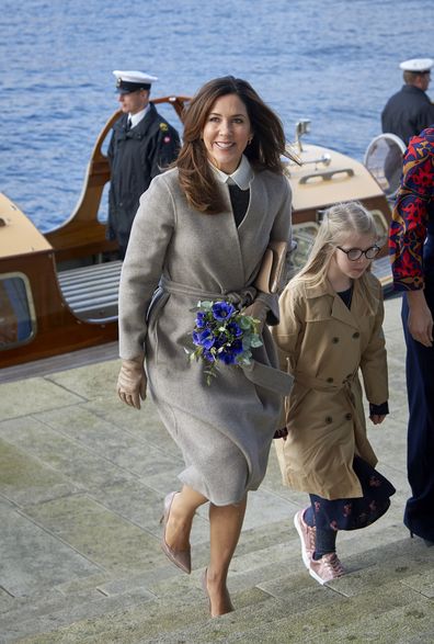 Princess Mary recycles favourite Prada dress for the sixth time as she returns to Denmark