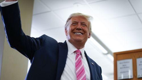 President Donald Trump talks with reporters after casting his ballot in the presidential election, Saturday, Oct. 24, 2020, in West Palm Beach, Fla