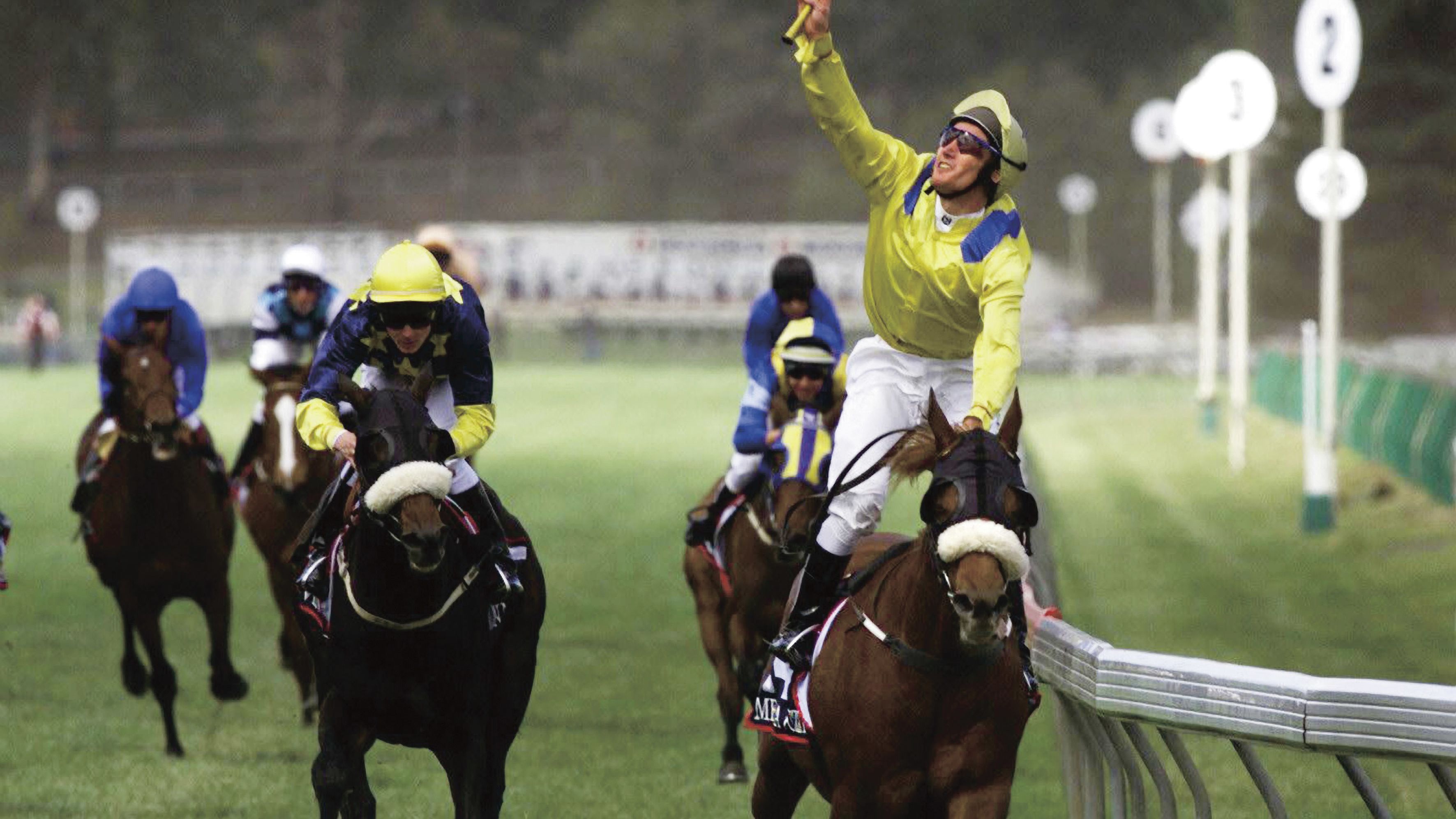 Damien Oliver blows a kiss to his brother Jason as Media Puzzle wins the 2002 Melbourne Cup.