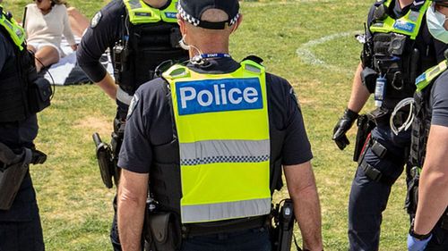 Victoria Police patrol at St Kilda beach.