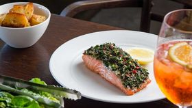 Oven baked ocean trout with tahini and soft herb salad