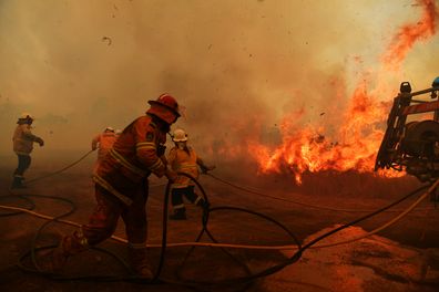 RFS Firefighters battle a spot fire on November 13, 2019 in Hillville, Australia. 