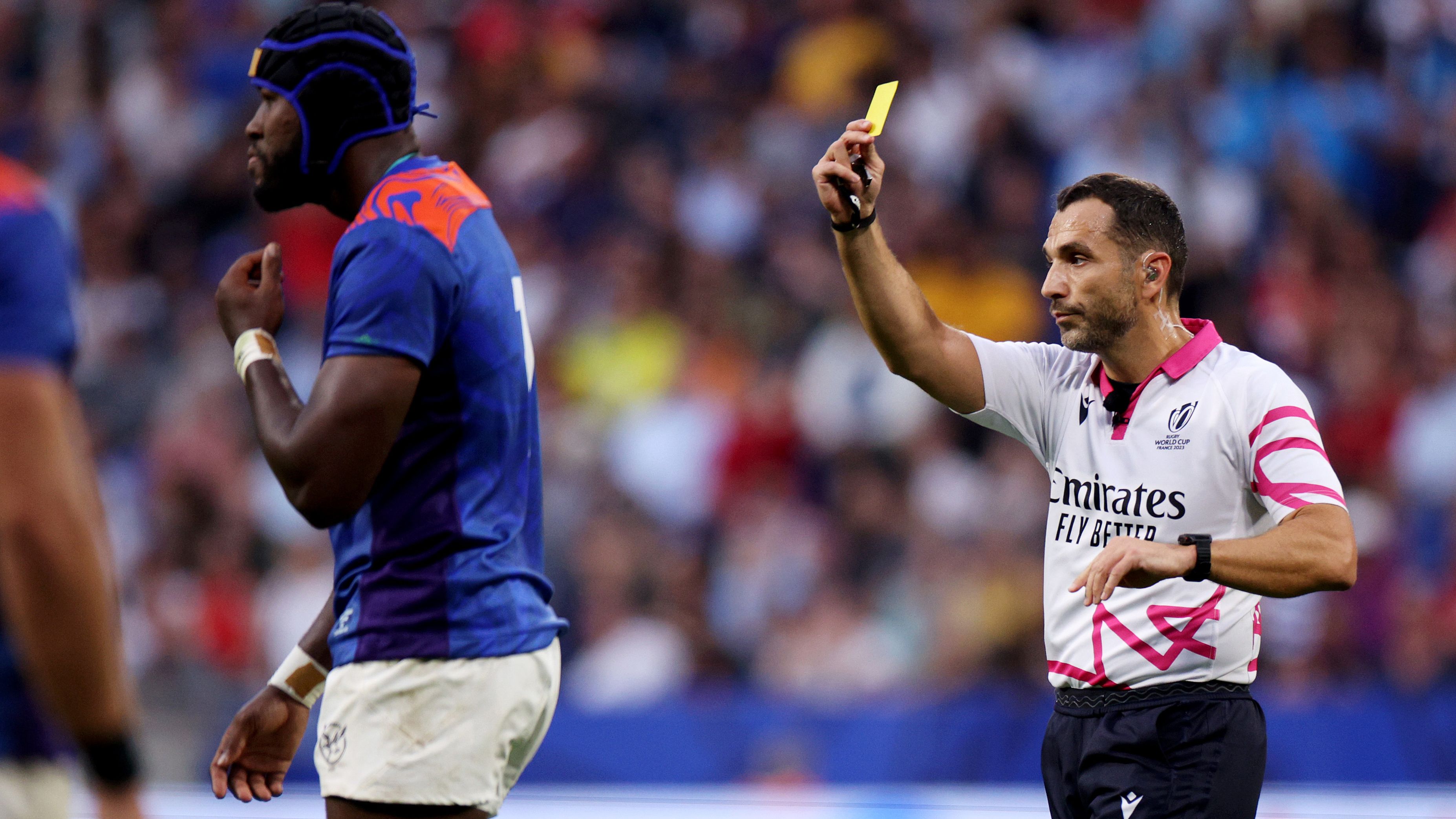 Tjiuee Uanivi of Namibia leaves the field after receiving a yellow card from Referee Mathieu Raynal, as a 8-Minute window for a TMO Bunker Review begins during the Rugby World Cup France 2023 match between Uruguay and Namibia at Parc Olympique on September 27, 2023 in Lyon, France. (Photo by Adam Pretty - World Rugby/World Rugby via Getty Images)