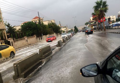 A flooded street in the city of Amman in Jordan after a sudden downpour.