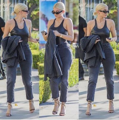 With swimwear as a form of outerwear ruling the runways,
Kylie Jenner has brought the trend to the streets.<br />
<br />
Yesterday, for an outing in Los Angeles with boyfriend
Travis Scott, the beauty mogul stepped out in a latex one-piece swimsuit, faded
jeans, a pinstripe blazer and strappy Manolo Blahnik heels.<br />
<br />
A gold Rolex watch, Balenciaga sunglasses and a slicked
ponytail gave the look a powerful and polished finish.<br />
<br />
The reality star&rsquo;s sleek off-duty look was a style step in a
different direction to her <a href="https://style.nine.com.au/2018/08/11/00/10/style-fashion-kardashians-dundas-world-kylie-jenner-21st-birthday" target="_blank" title="21st birthday attire from the weekend." draggable="false">21st birthday attire from the weekend.</a><br />
<br />
The extravagant coming-of-age celebrations saw the
mother-of-one don three high-voltage outfits by the like of Peter Dundas,
LaBourjoisie and Tom Ford-era Gucci.<br />
<a href="https://style.nine.com.au/2018/08/08/10/07/style-evolution-kylie-jenner" target="_blank" draggable="false"><br />
Figure-hugging attire with a playful twist</a>
has long been a part of Jenner&rsquo;s signature look.<br />
<br />
"I change my style maybe every month," Jenner told&nbsp;<em><a href="https://people.com/style/teen-hair-change-alert-kylie-jenner-goes-back-to-blue-and-hailee-steinfeld-gets-a-major-cut-photos/" target="_blank" title="People" draggable="false">People</a> </em>of her chameleon ways.<br />
<br />
"I&rsquo;m like punk one month, ghetto fab the next, classy
the next. I&rsquo;m just young and finding out who I am."<br />
<br />
Click through to see the most risqu&eacute; outfits Kylie Jenner
has stepped out in.
