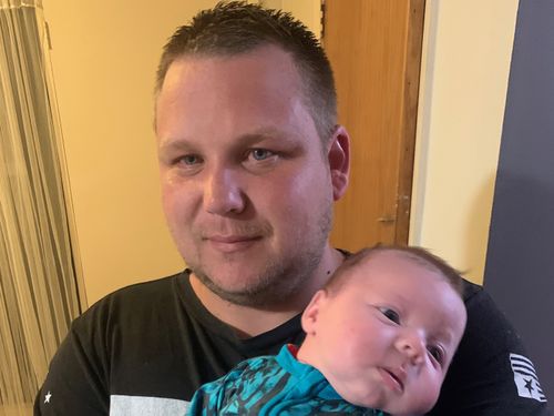 Tim Walls with seven-week-old Frankie.