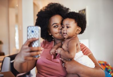 Cropped shot of a young woman taking a selfie with her baby girl