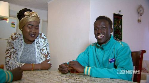 Deng with his sister Margaret. Picture: 9NEWS