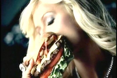 This was actually for an ad...yep, Paris got paid to scoff a burger.
