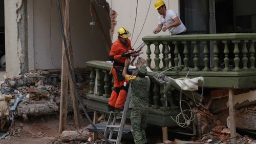 A rescuer responds to the earthquake in Mexico. (AAP)