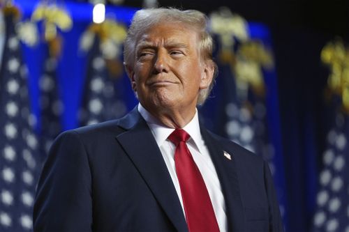 Republican presidential candidate former President Donald Trump arrives at an election night party at the Palm Beach Convention Center, Wednesday, Nov. 6, 2024, in West Palm Beach, Fla. (AP Photo/Evan Vucci)