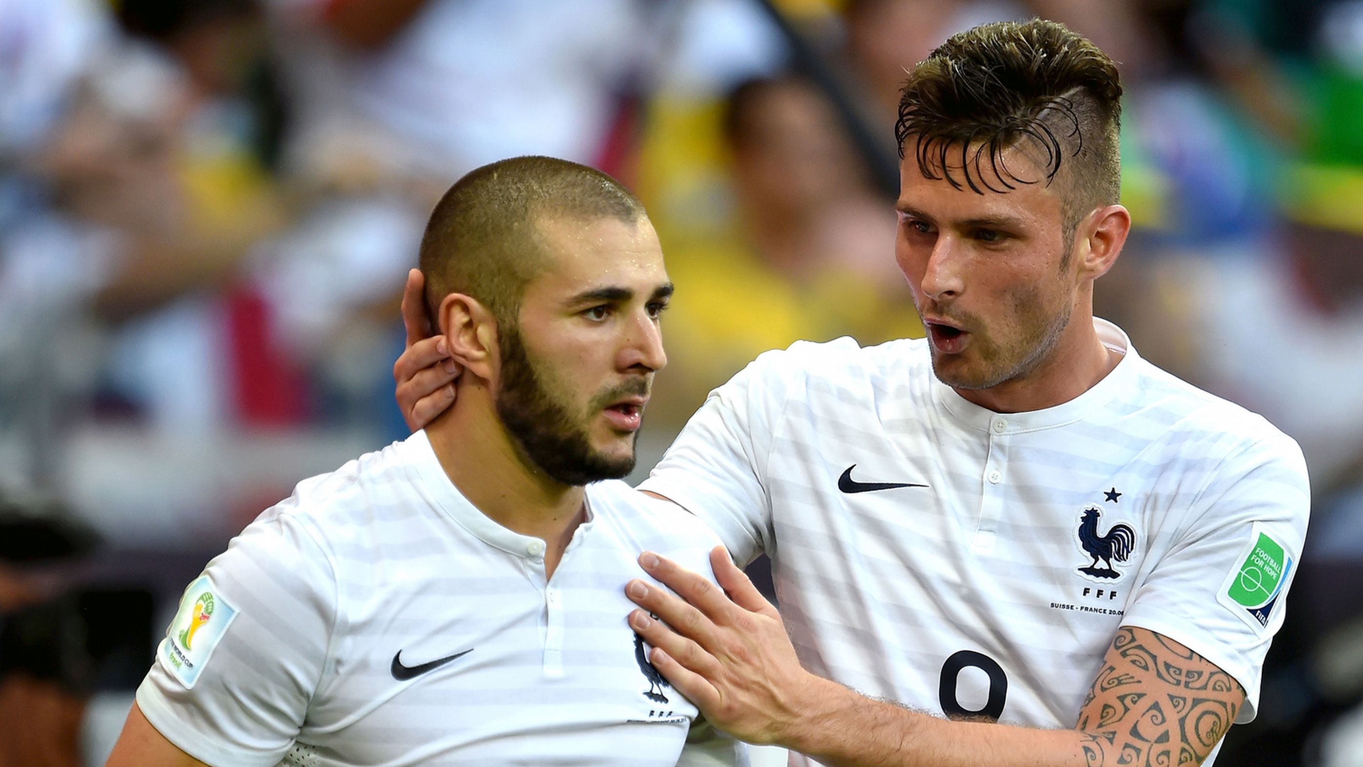Karim Benzema of France is congratulated by teammate Olivier Giroud.