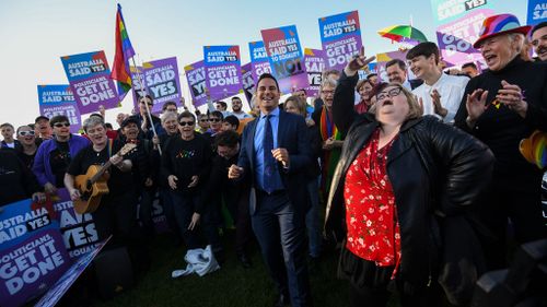 Same-sex marriage campaigner Alex Greenwich and Magda Szubanski danced as they called on politicians to pass marriage equality legislation during an equality rally outside Parliament House in Canberra yesterday (AAP)
